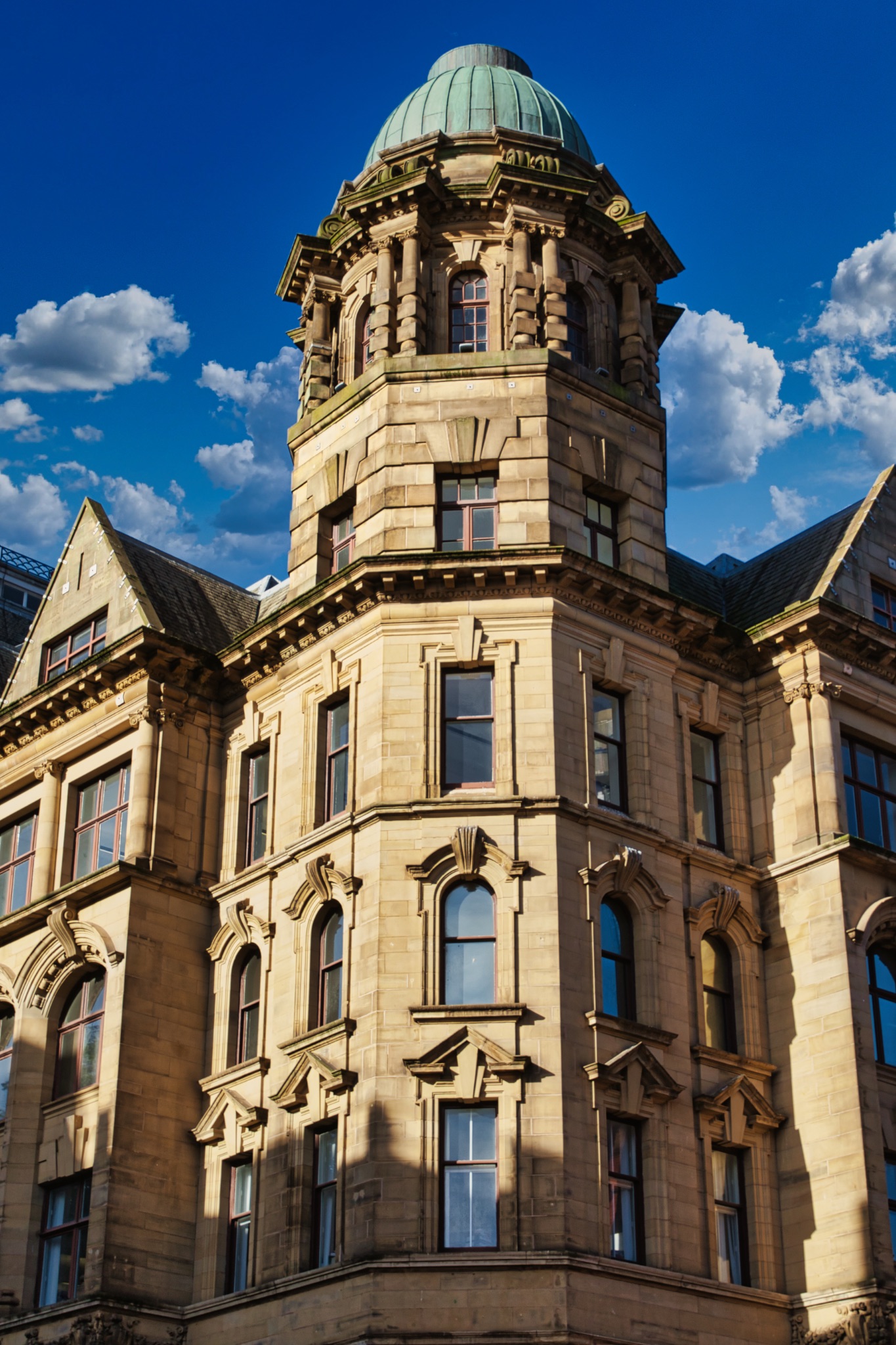 Stone Building with Domed Roof and Windows in Manchester, UK.